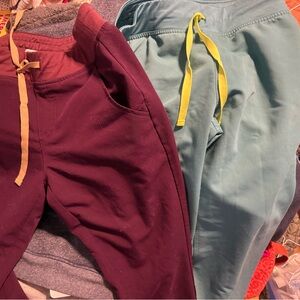 Figs Jogger Pants in Burgundy and straight leg Teal with Yellow Drawstrings